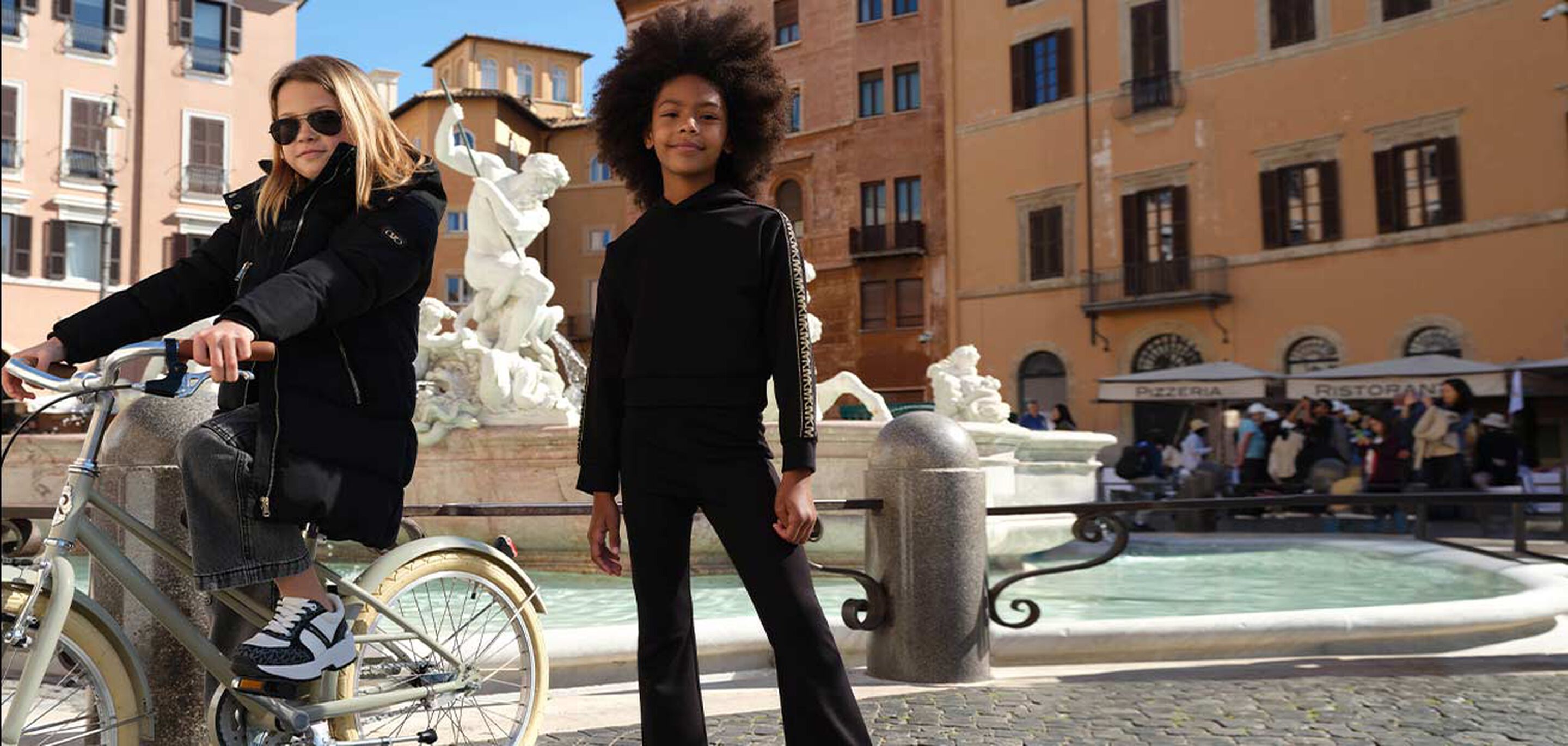 Halloween crafting time – kids painting pumpkins and paper ghosts.